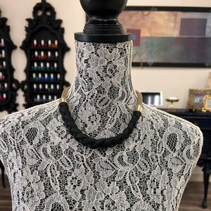 Elegant Black and Gold Necklace

Black rope and Gold chain design 
19” long